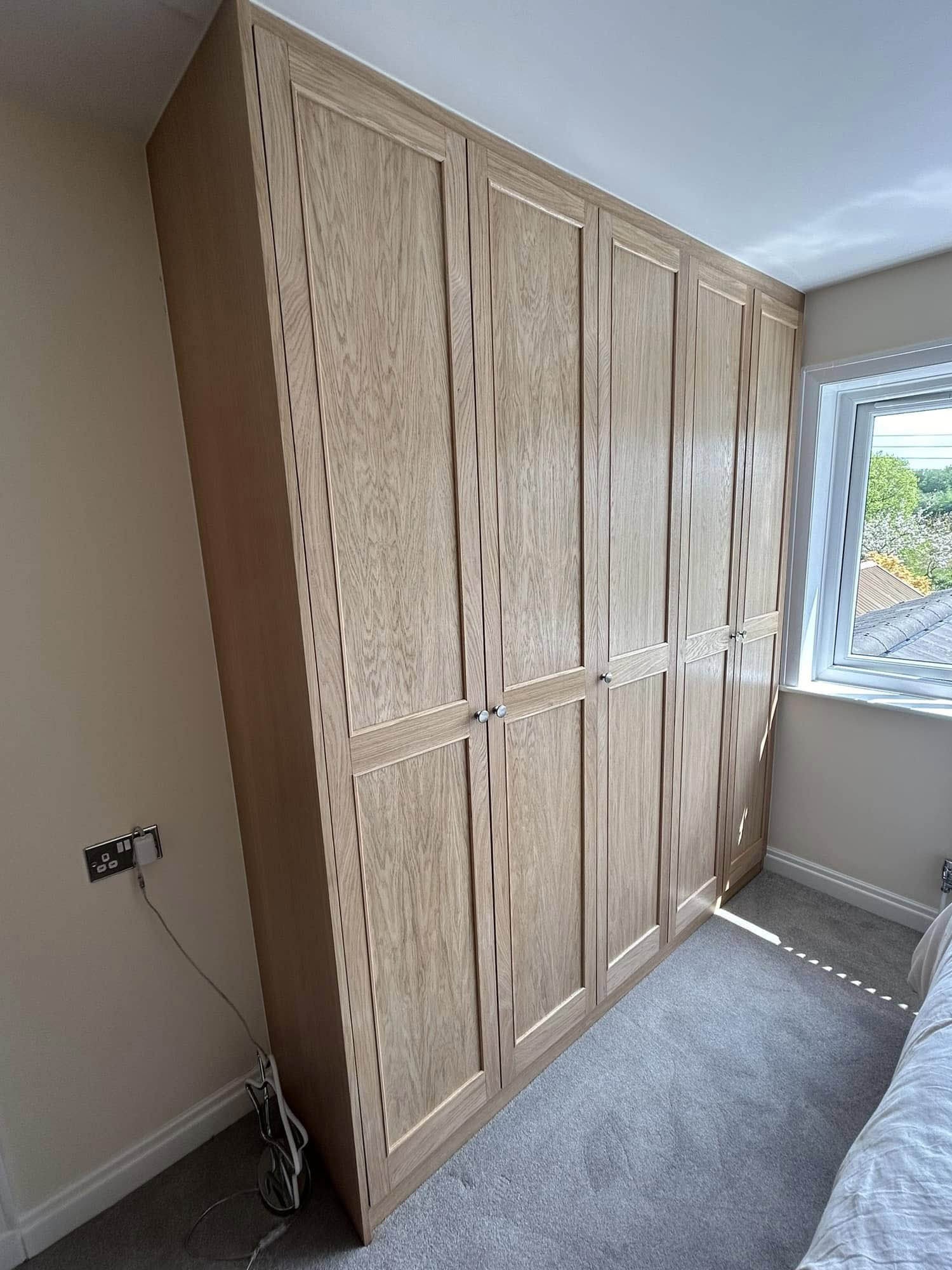 Custom fitted wardrobe with built-in storage solutions